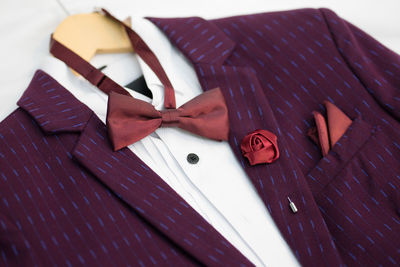 Close-up of suit with bow tie