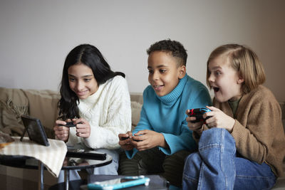 Children playing video games at home