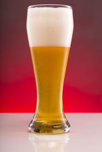 Close-up of beer glass against white background