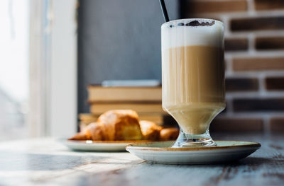 Close-up of coffee served on table