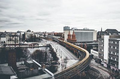 High angle view of road amidst buildings against sky