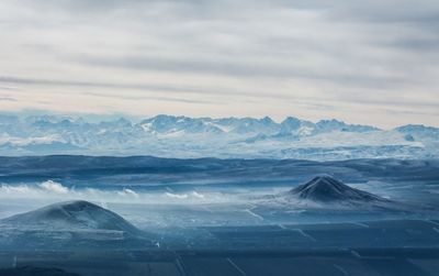 Scenic view of snowcapped mountains against sky