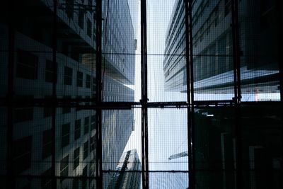 Reflection of buildings on glass window