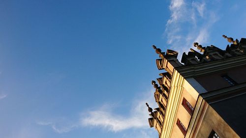 Low angle view of statue against cloudy sky