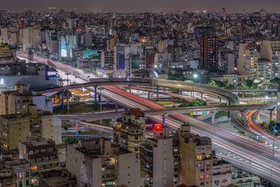 High angle view of illuminated buildings in city against sky