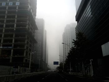 View of skyscrapers in fog