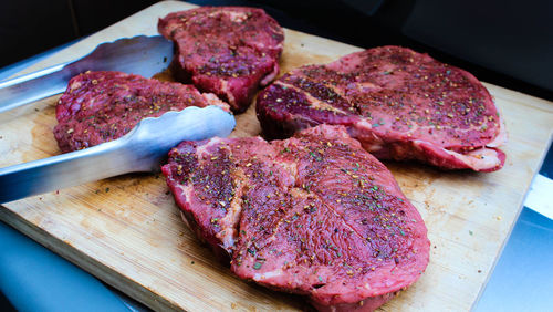 High angle view of meat on cutting board