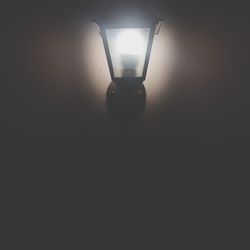 Illuminated electric lamp in dark room