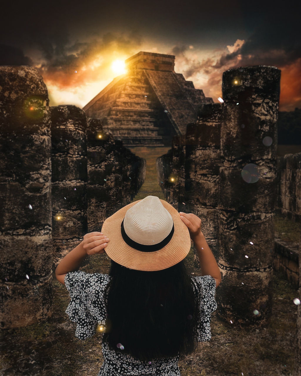 one person, sun hat, hat, adult, cowboy hat, clothing, darkness, sky, architecture, nature, fashion accessory, women, light, fedora, night, building exterior, lifestyles, cloud, sunset, built structure, leisure activity, outdoors, landscape, city, reflection, rear view, person