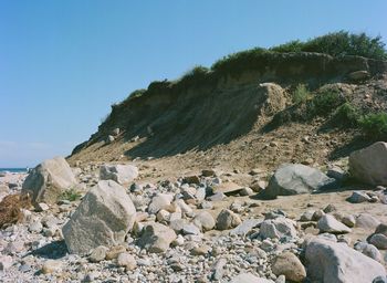 Scenic view of beach against clear blue sky