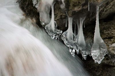 Panoramic view of frozen waterfall