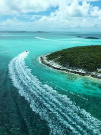 Scenic view of calm sea against cloudy sky