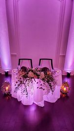 Flower vase on table at home