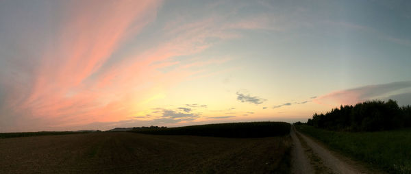 Scenic view of road against sky during sunset