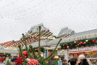 Group of people on plant against building