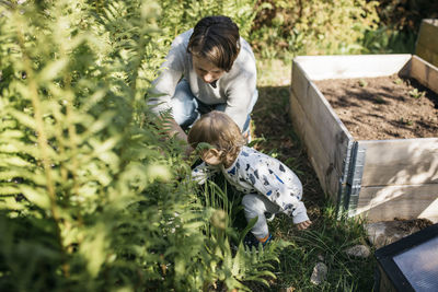 Mother with daughter in garden