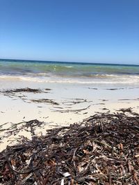 Scenic view of sea against clear blue sky