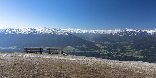 Scenic view of mountains against clear blue sky