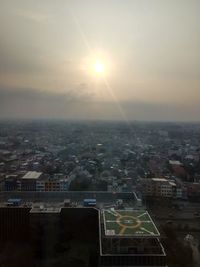 High angle view of buildings against sky during sunset