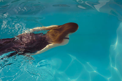 Woman swimming in pool