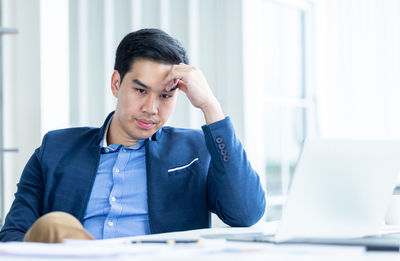 Young man using laptop on table