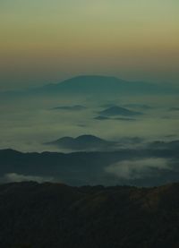 Scenic view of mountains against sky during sunset