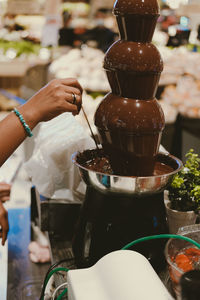 Chocolate fondue fountain dripping sauce for dipping fruit