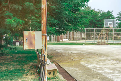Built structure on field against trees