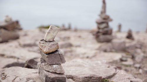 Close-up of stack of stones on beach