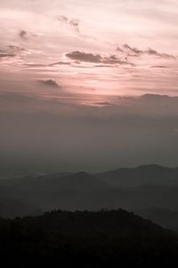 Scenic view of silhouette mountains against sky during sunset