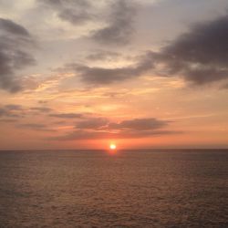 Scenic view of sea against sky at sunset