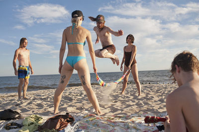 Friends hanging out together on a beach