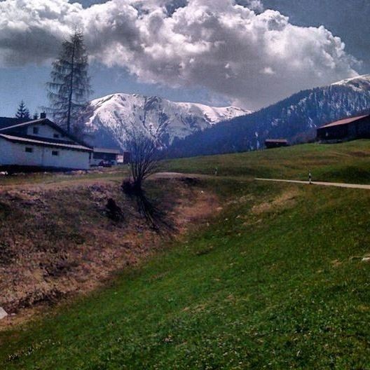 mountain, mountain range, sky, snow, landscape, cloud - sky, winter, grass, cold temperature, tranquil scene, snowcapped mountain, tranquility, transportation, scenics, beauty in nature, weather, nature, cloudy, non-urban scene, cloud