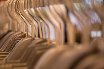 Close-up of clothes hanging at rack