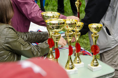 Sports cups on the table of judges before awarding the winners