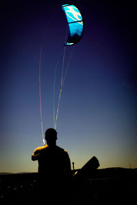 Man photographing against sky