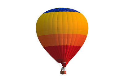 Hot air balloon flying over white background