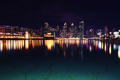 Illuminated cityscape at night