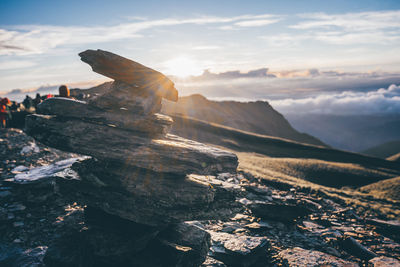 Scenic view of rocks on mountain against sky