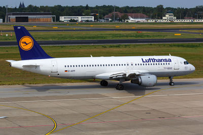 View of airplane at airport runway