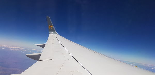 Airplane flying over blue sky