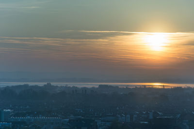 High angle view of townscape against sky during sunset