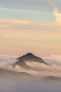 Scenic view of mountains against sky during sunset