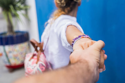 Close-up of woman holding hands