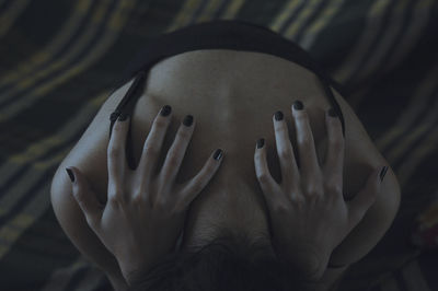 High angle view of woman on bed