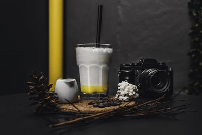 Close-up of drink with camera on table