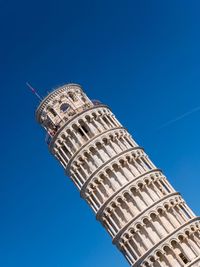 Low angle view of building against blue sky