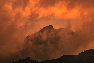 Low angle view of dramatic sky during sunset