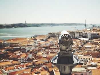 Close-up of cityscape against sea