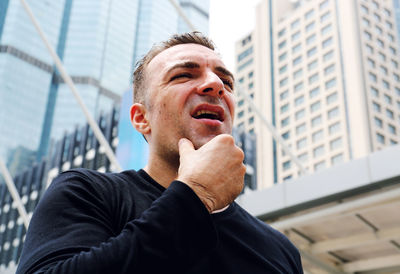 Portrait of smiling man in city